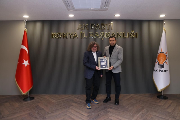 AKSED'den Başkan Özgökçen'e hatıra para takdimi